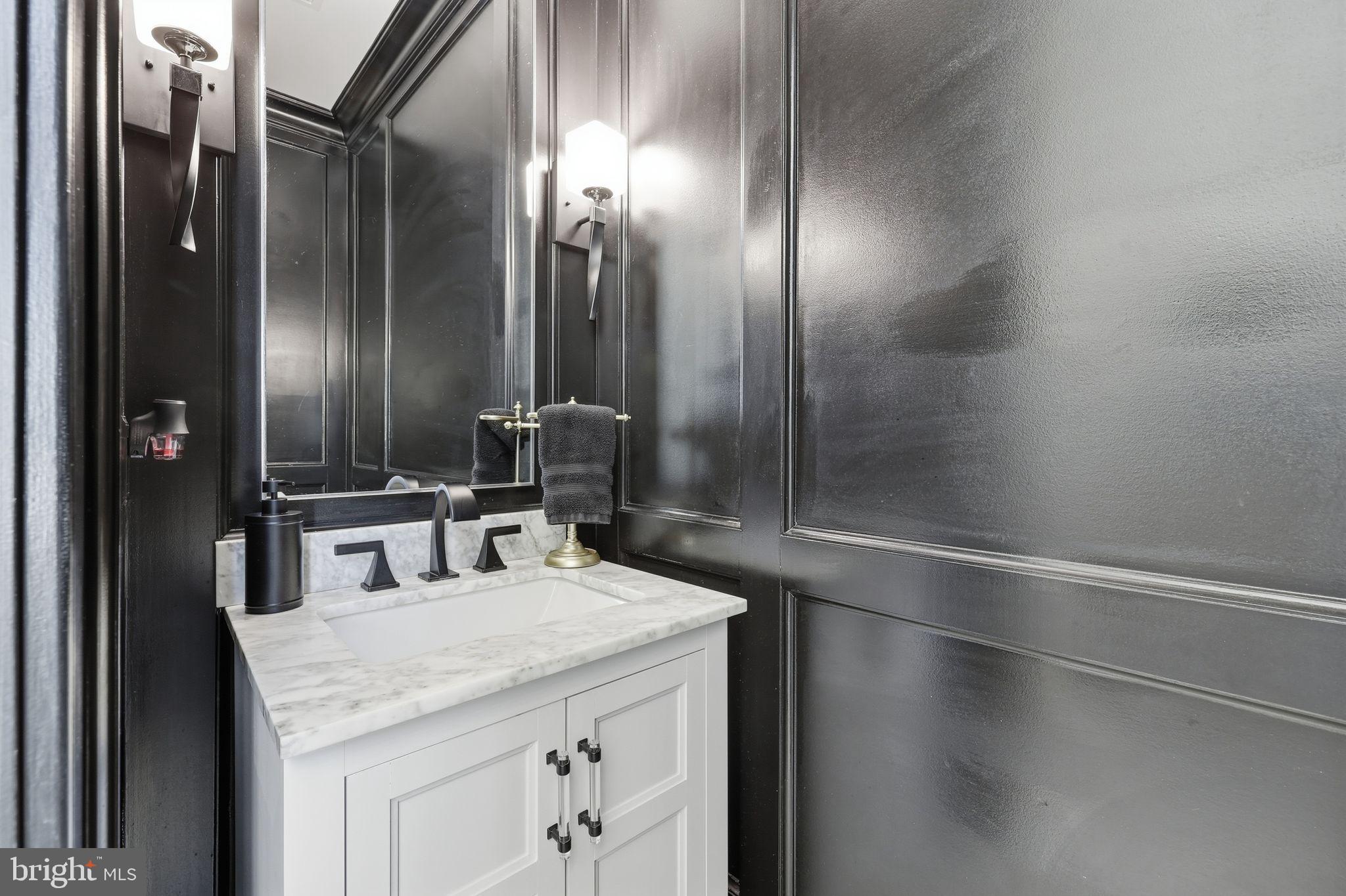 306 Shore Lane Milford, DE 19963 - Photo 16 of 38 a bathroom with a sink and a mirror