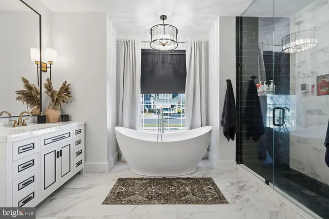 a living room with a baby crib and a fireplace