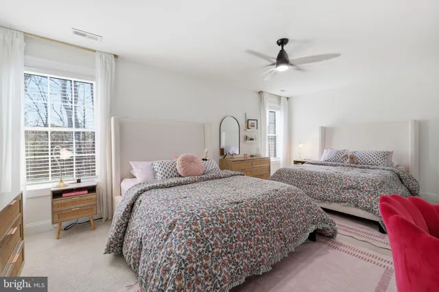 a bedroom with bed and a window