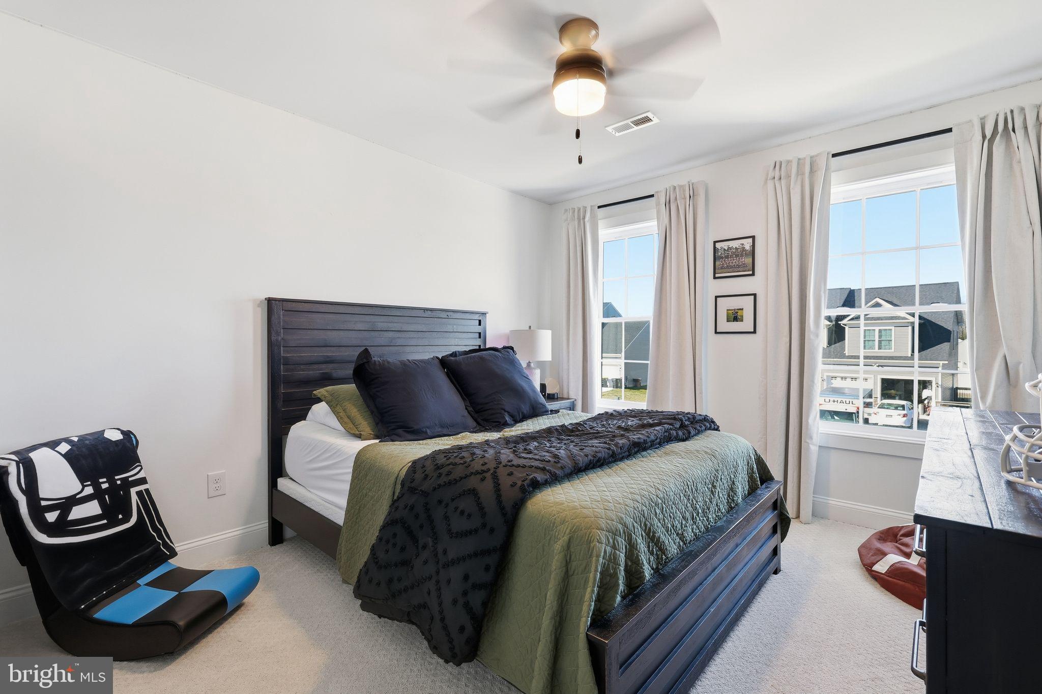 306 Shore Lane Milford, DE 19963 - Photo 25 of 38 a bedroom with a bed a window and gym equipment