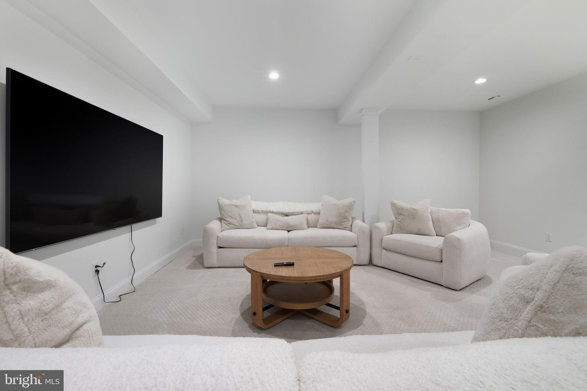 306 Shore Lane Milford, DE 19963 - Photo 29 of 38 a living room with furniture and a flat screen tv