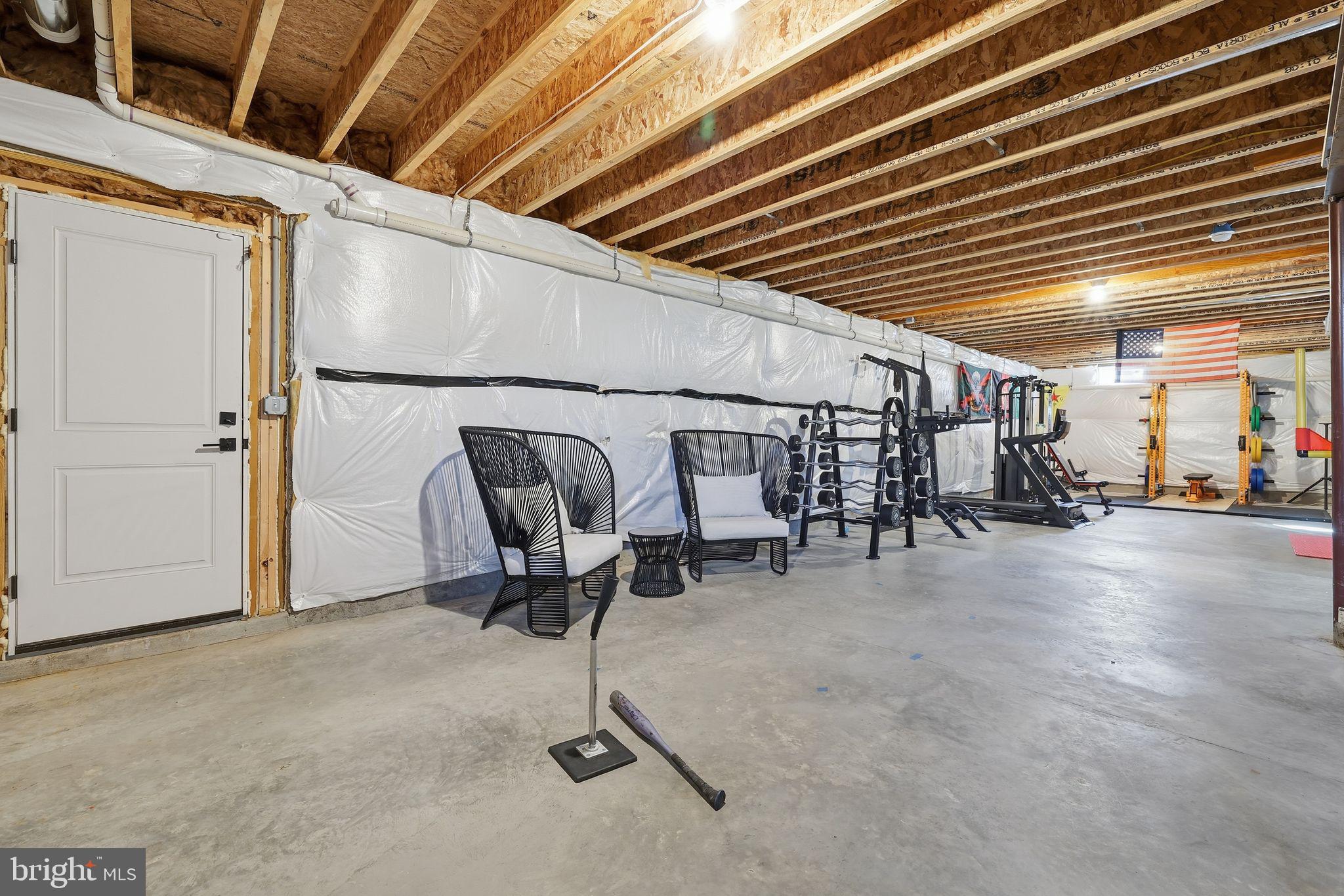 306 Shore Lane Milford, DE 19963 - Photo 31 of 38 a view of a hallway with a table and chairs