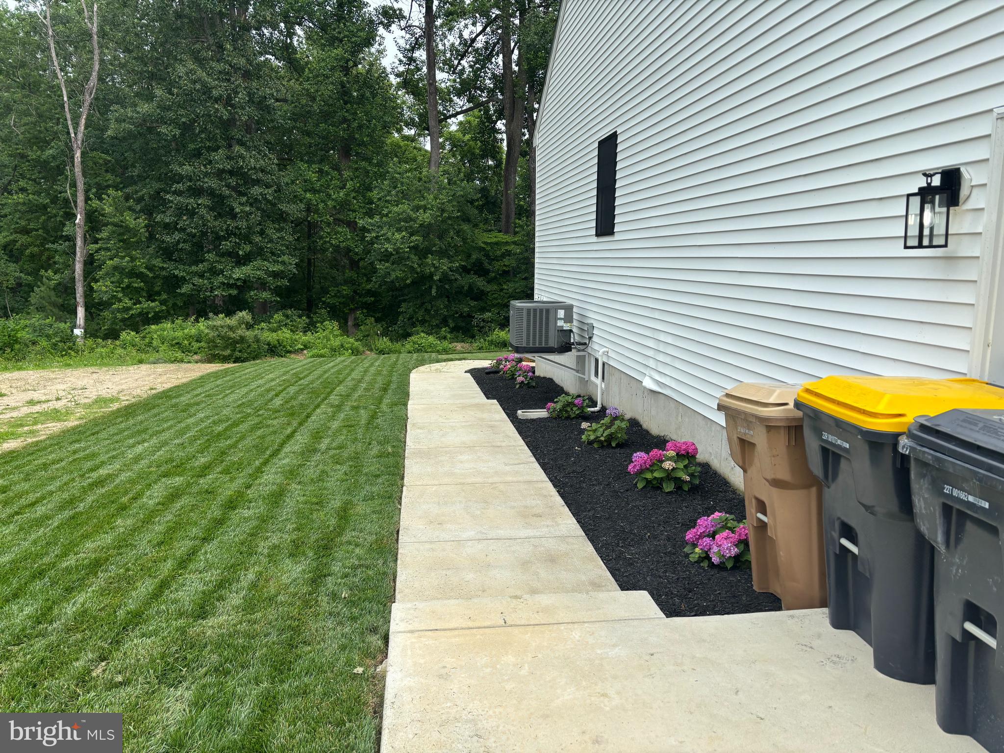 306 Shore Lane Milford, DE 19963 - Photo 38 of 38 a view of a chairs and table in backyard of the house