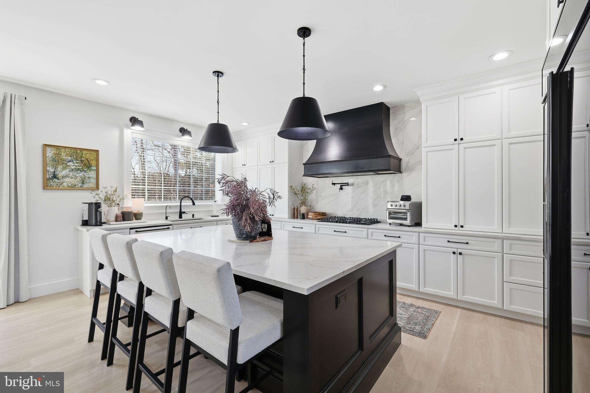 306 Shore Lane Milford, DE 19963 - Photo 5 of 38 a kitchen with stainless steel appliances a sink stove and refrigerator