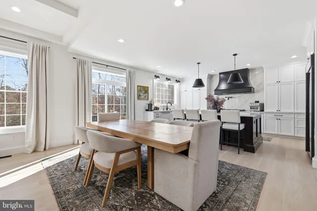 a kitchen with stainless steel appliances kitchen island granite countertop a sink and cabinets