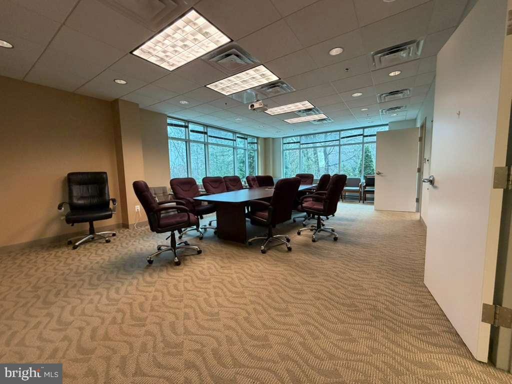 1984 Isaac Newton Square West, Unit 209 Reston, VA 20190 - Photo 5 of 9 a view of a workspace with furniture and a window