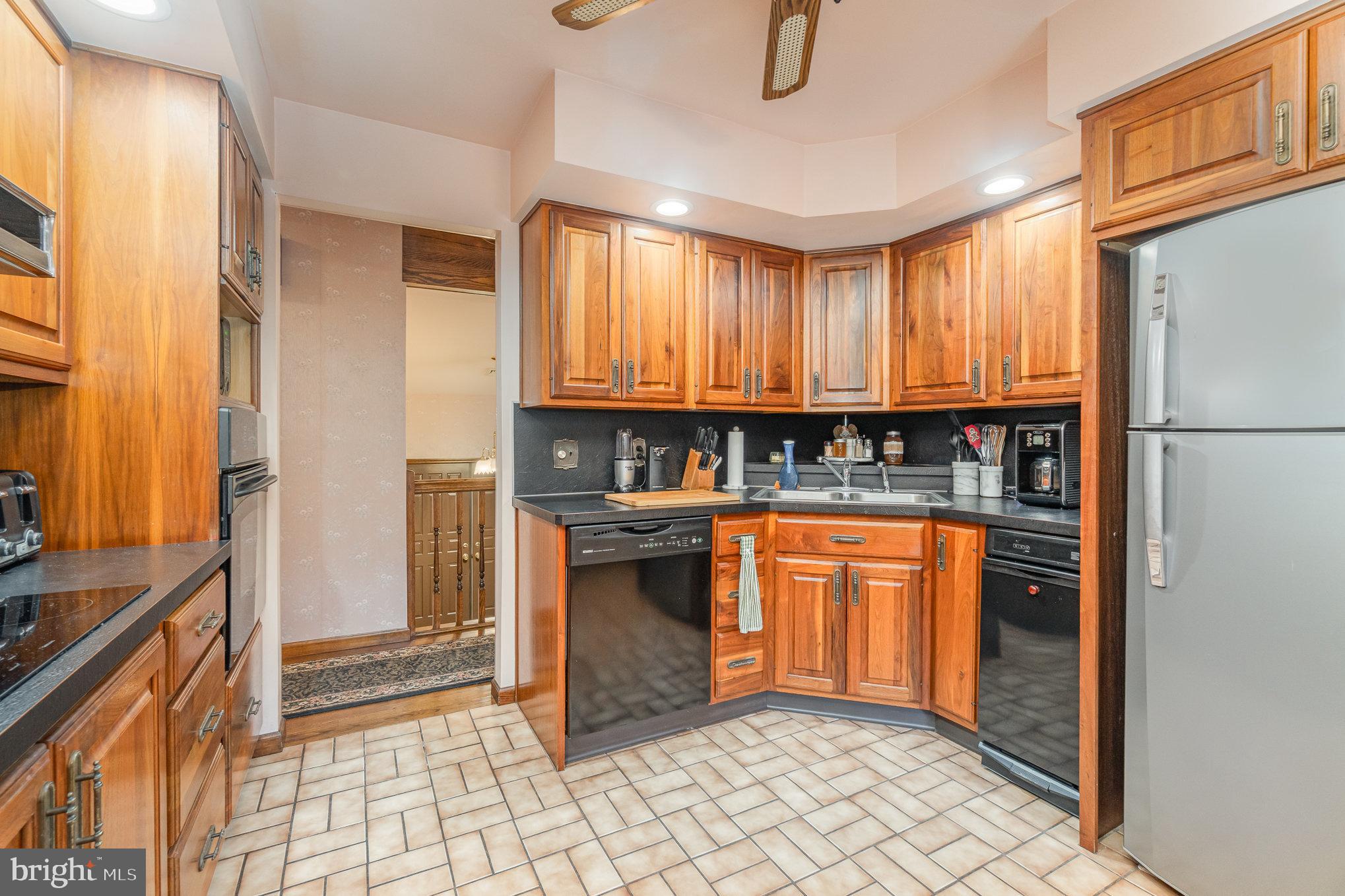 48 Turnpike Road Ashland, PA 17921 - Photo 11 of 60 a kitchen with stainless steel appliances granite countertop a refrigerator and a sink