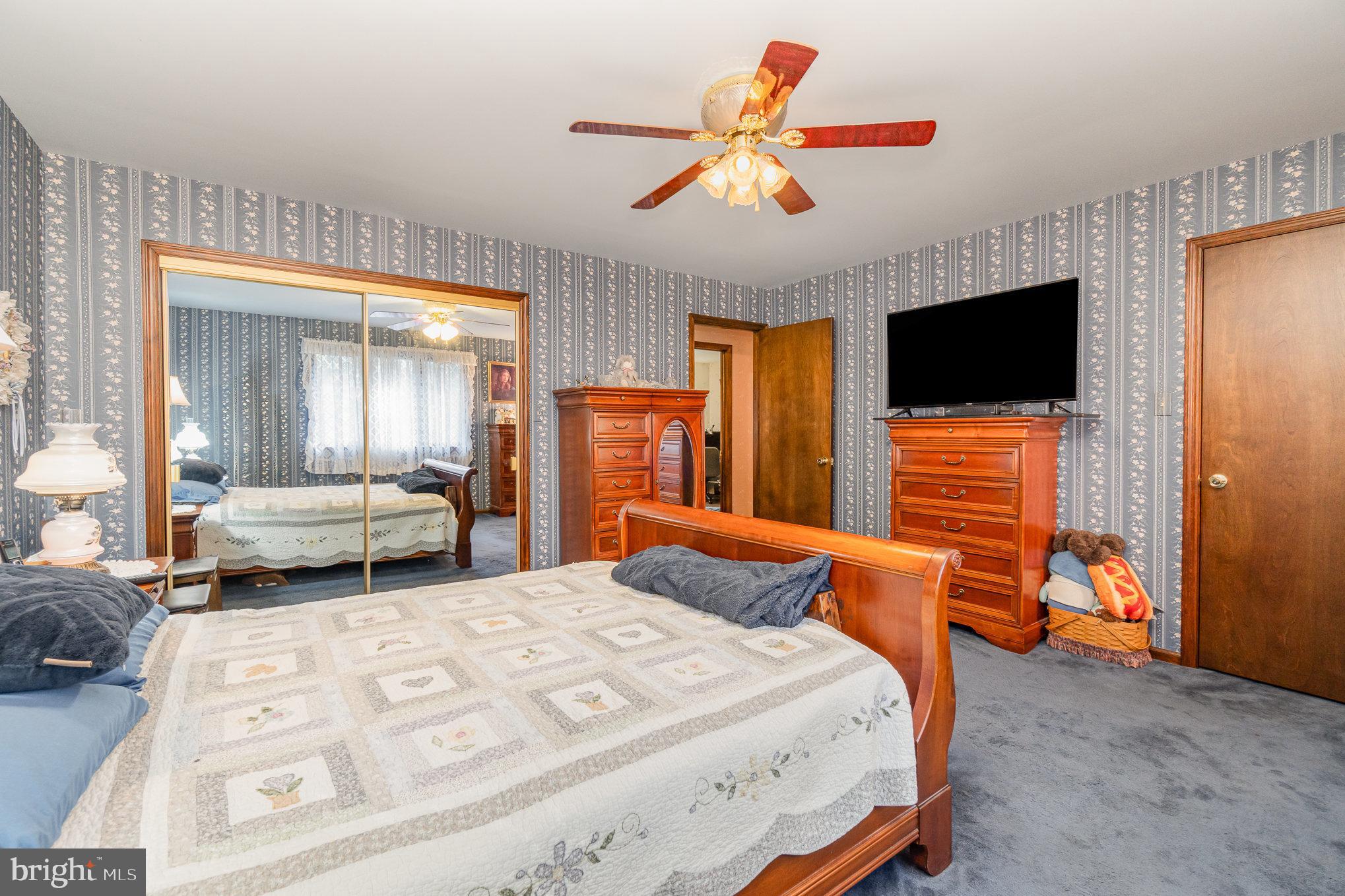 48 Turnpike Road Ashland, PA 17921 - Photo 20 of 60 a bedroom with a bed and a flat screen tv