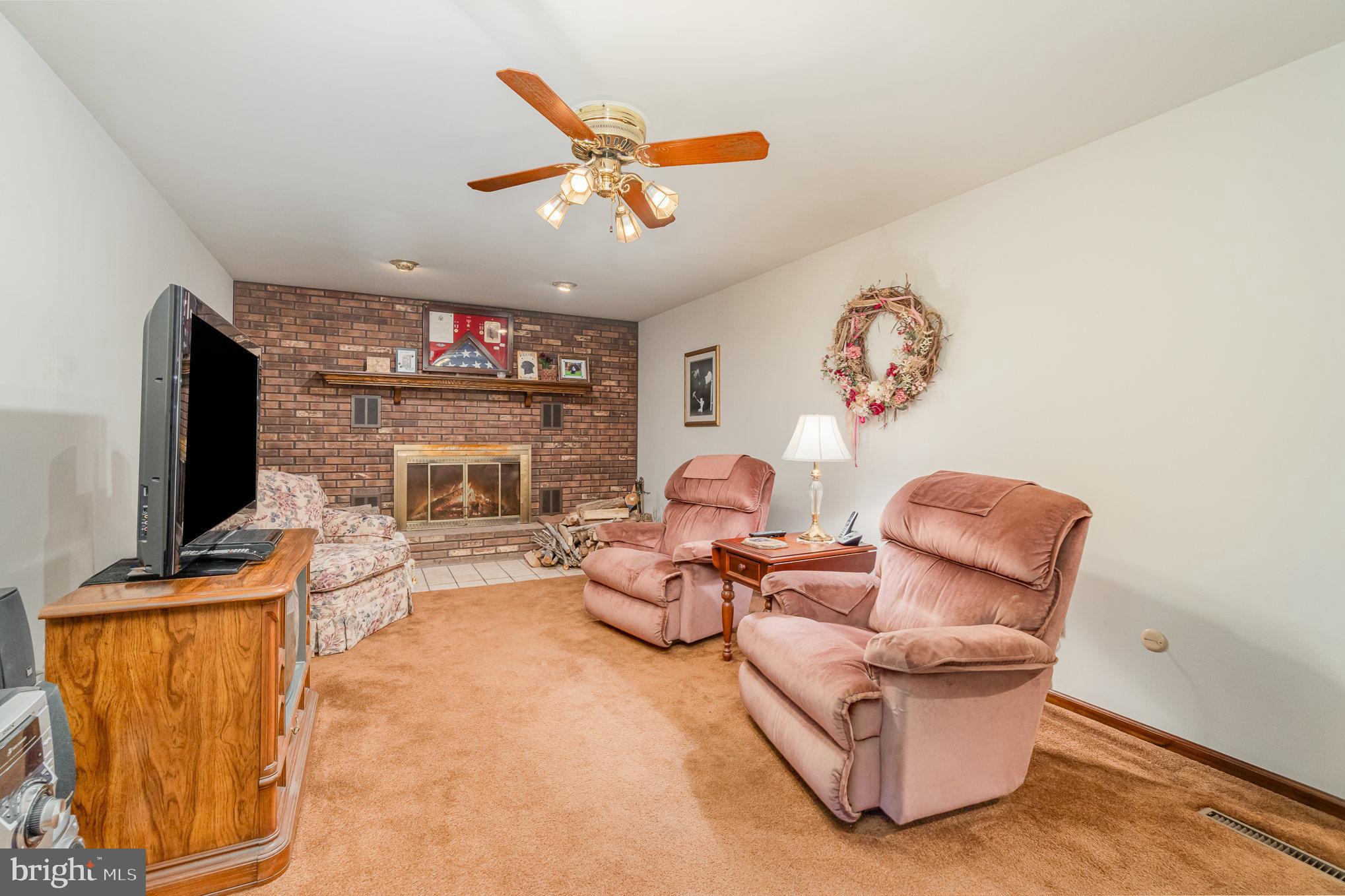 48 Turnpike Road Ashland, PA 17921 - Photo 23 of 60 a living room with furniture a flat screen tv and a fireplace