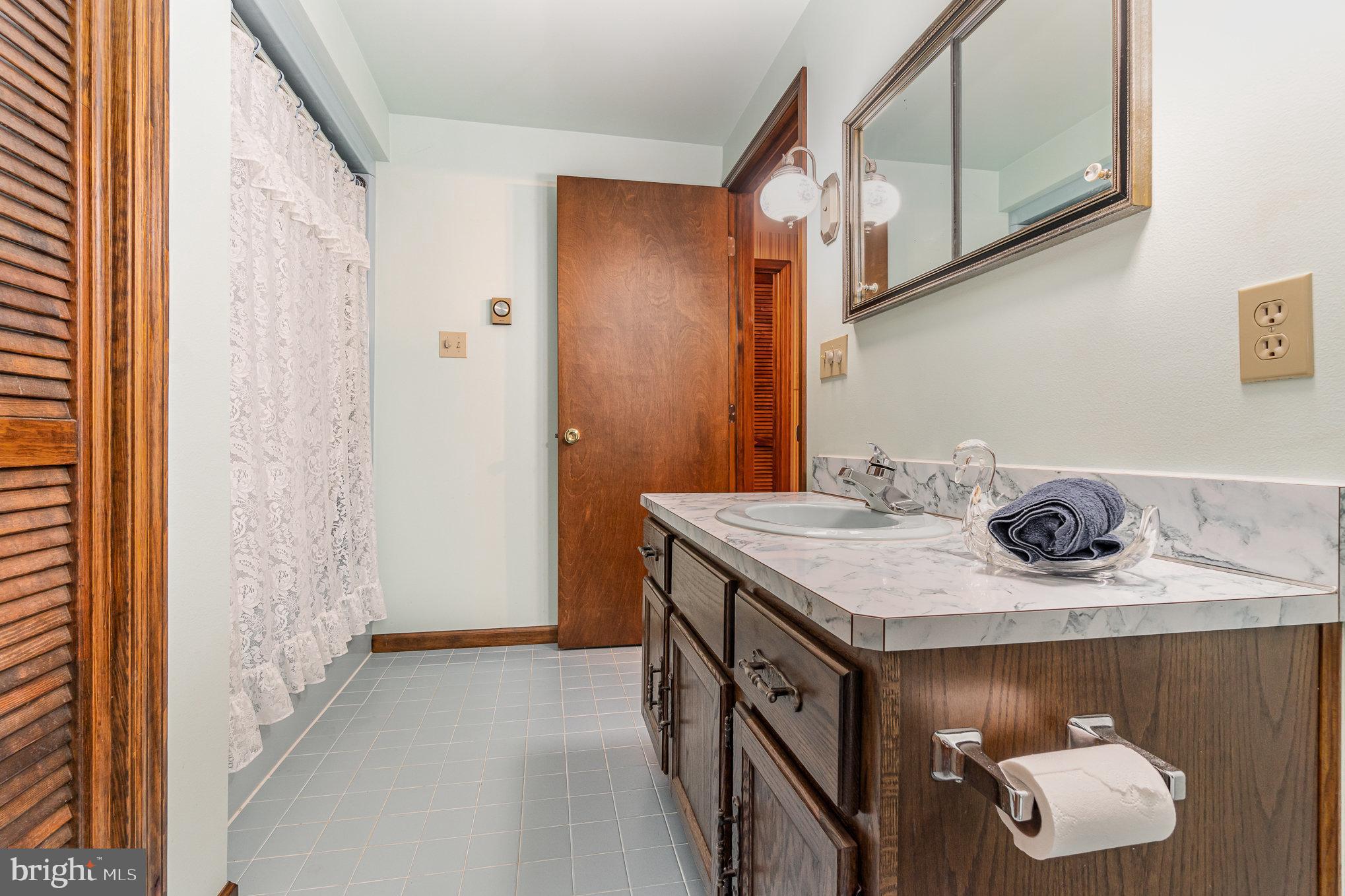48 Turnpike Road Ashland, PA 17921 - Photo 36 of 60 a bathroom with a sink and a mirror