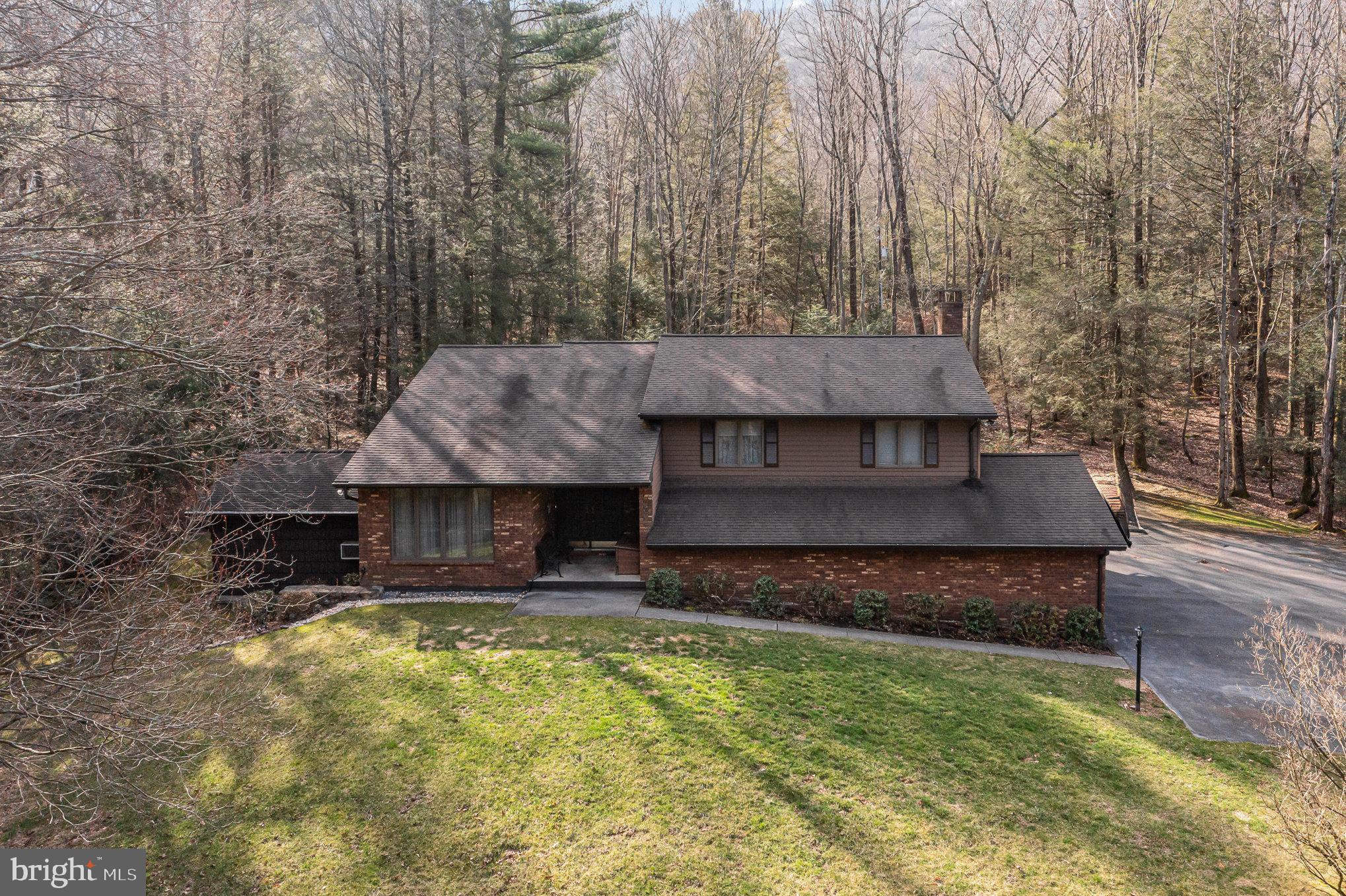 48 Turnpike Road Ashland, PA 17921 - Photo 46 of 60 a front view of a house with a yard