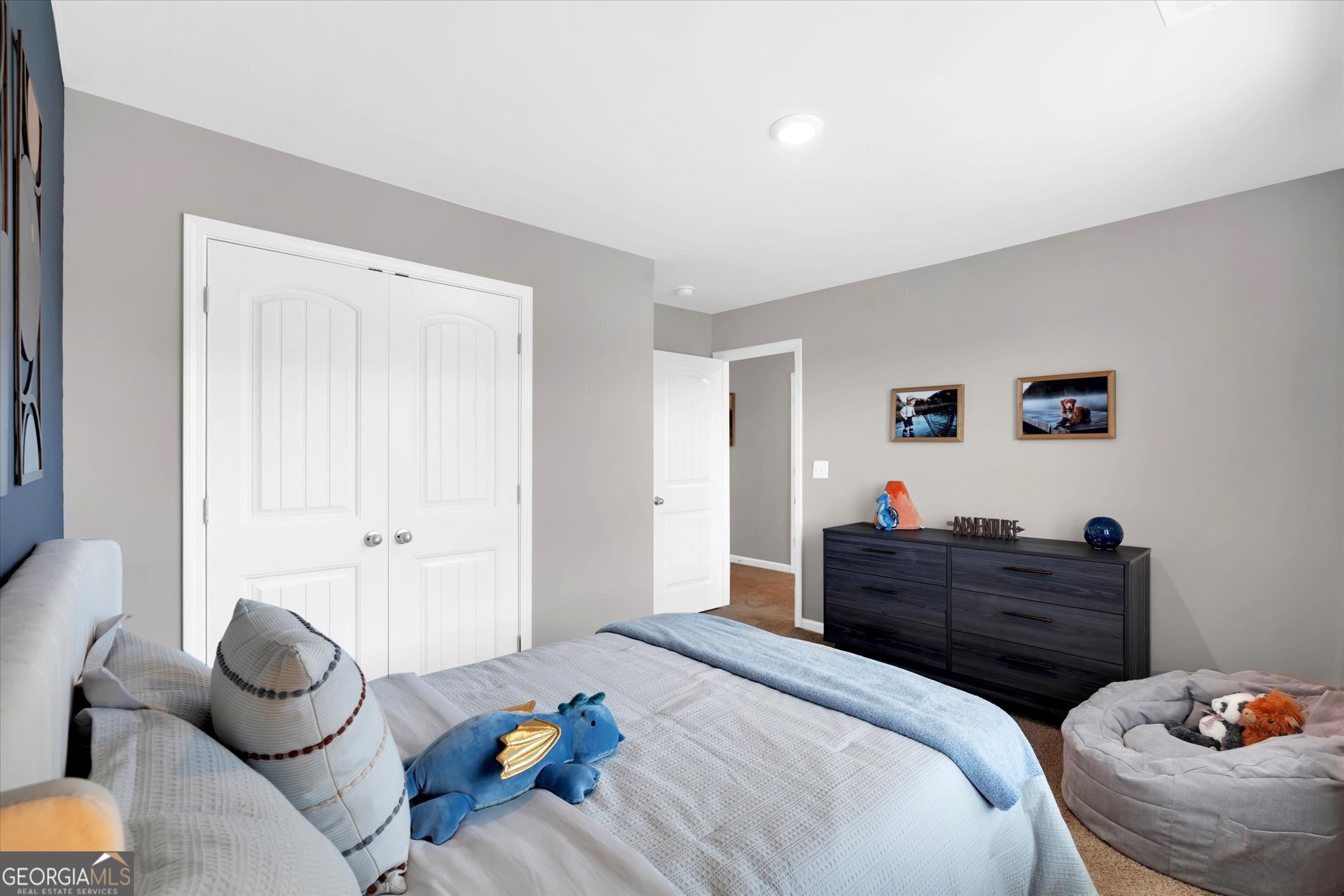 304 Rusty Plow Lane, Unit 22 Perry, GA 31069 - Photo 12 of 25 a bedroom with a bed and a potted plant