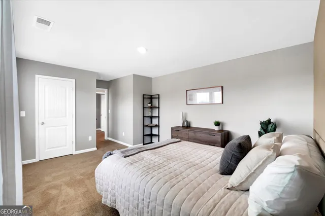 a bed room with a bed and a night stand