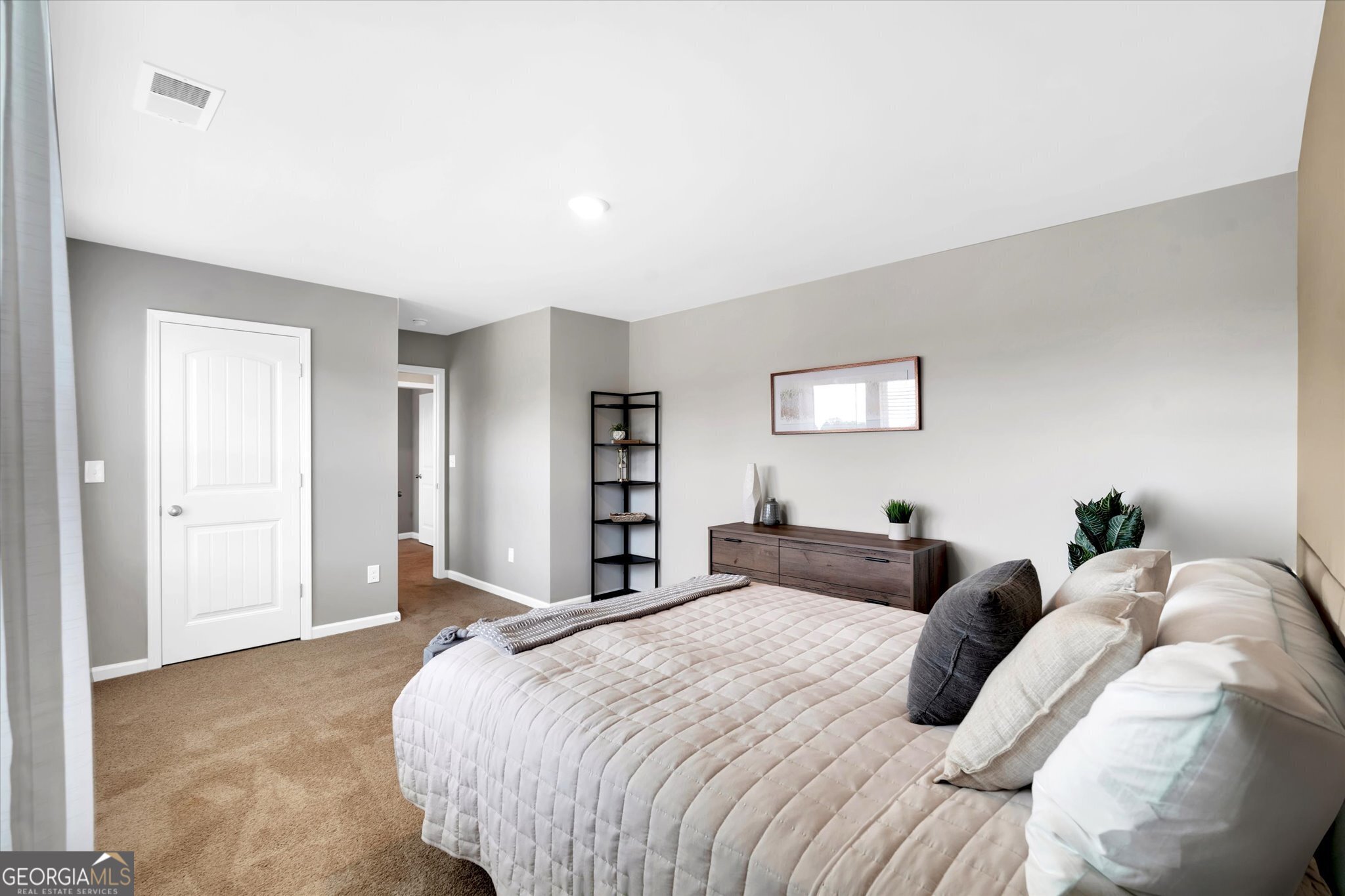 304 Rusty Plow Lane, Unit 22 Perry, GA 31069 - Photo 17 of 25 a bed room with a bed and a night stand