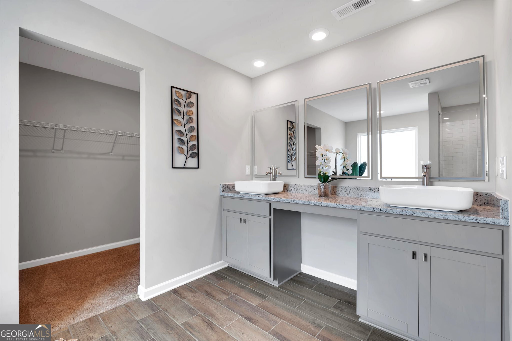 304 Rusty Plow Lane, Unit 22 Perry, GA 31069 - Photo 20 of 25 a bathroom with a granite countertop sink mirror and vanity