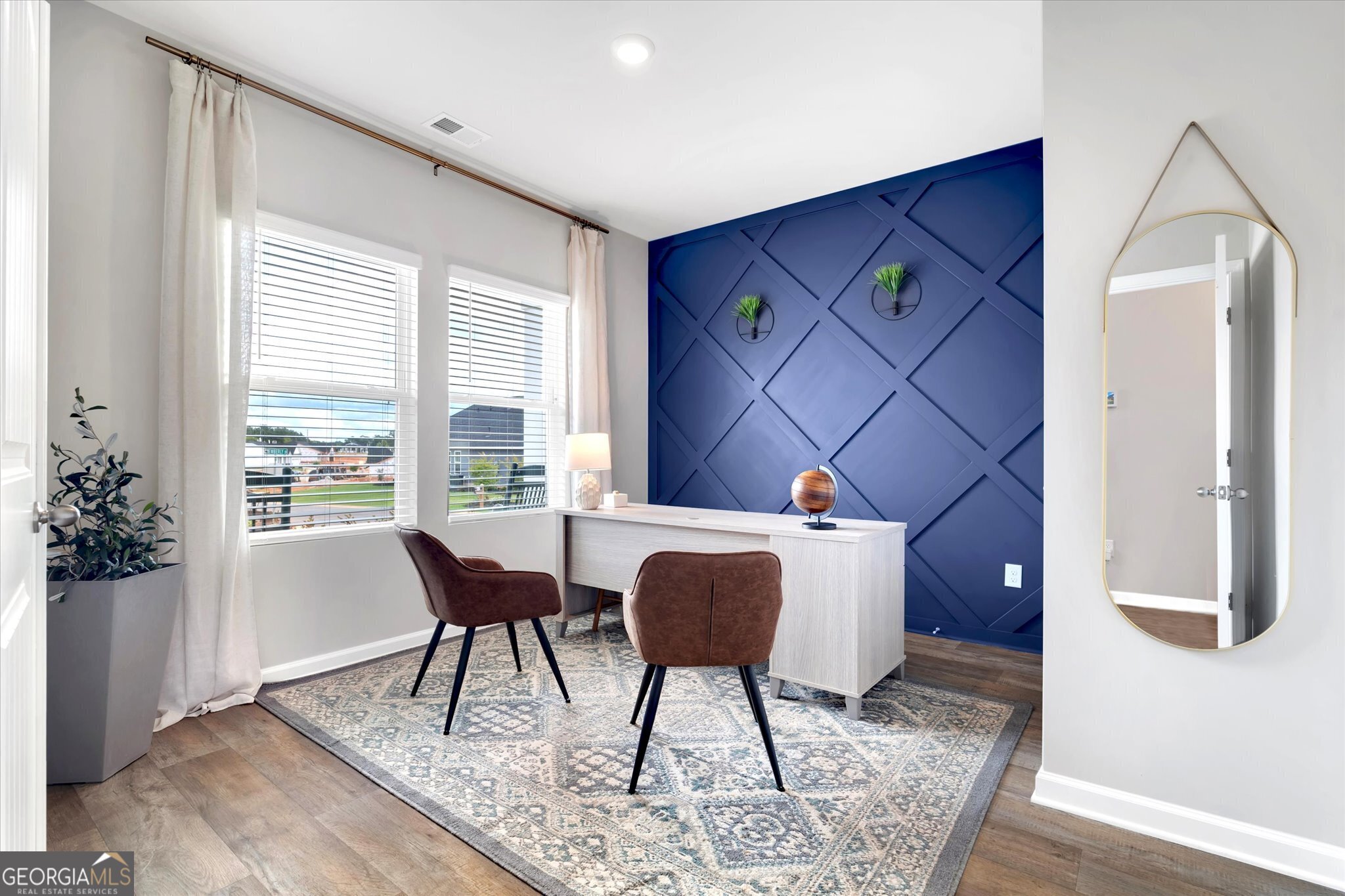 304 Rusty Plow Lane, Unit 22 Perry, GA 31069 - Photo 2 of 25 a workspace room with furniture and wooden floor