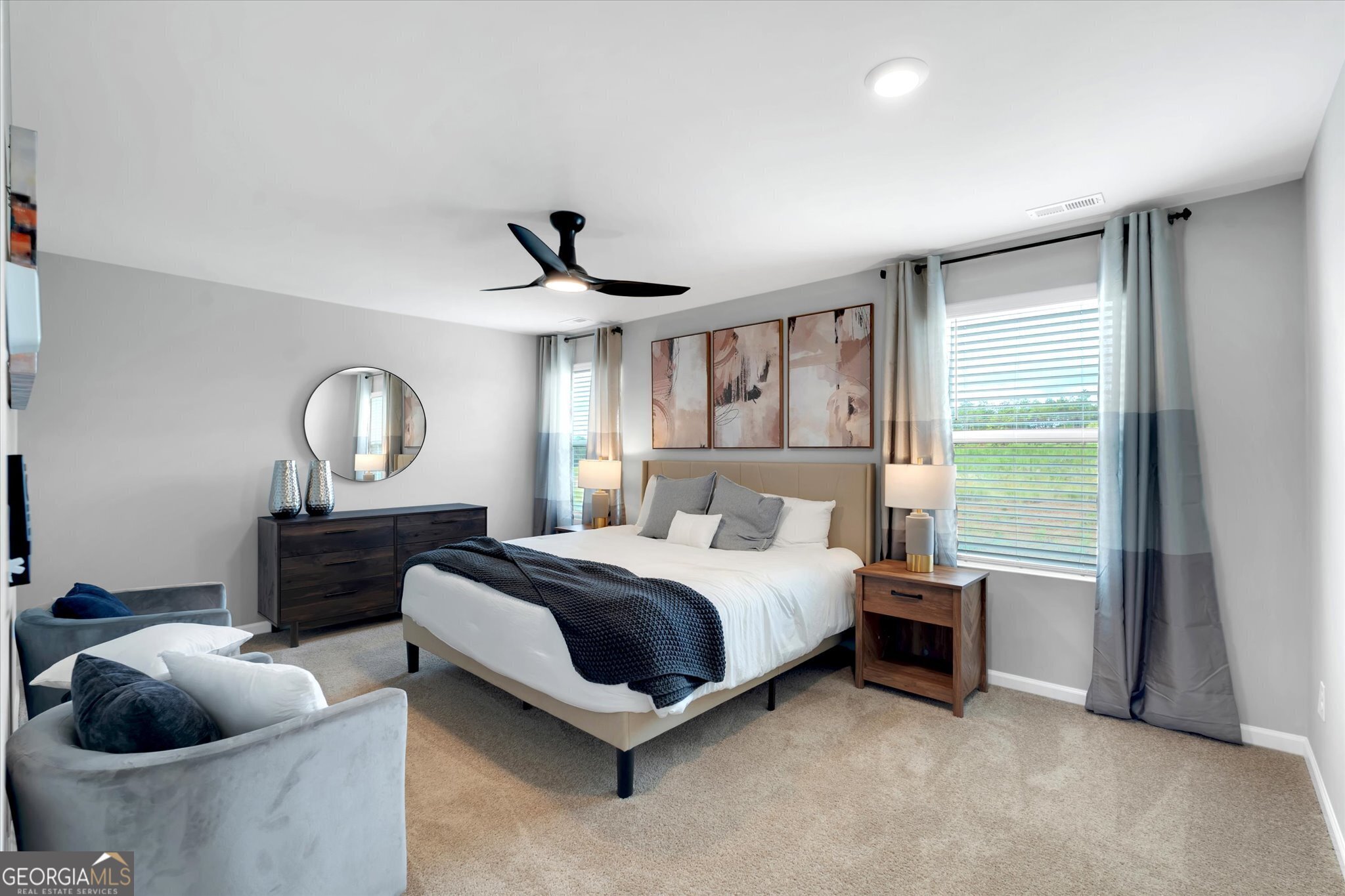 304 Rusty Plow Lane, Unit 22 Perry, GA 31069 - Photo 23 of 25 a spacious bedroom with a bed and a chandelier