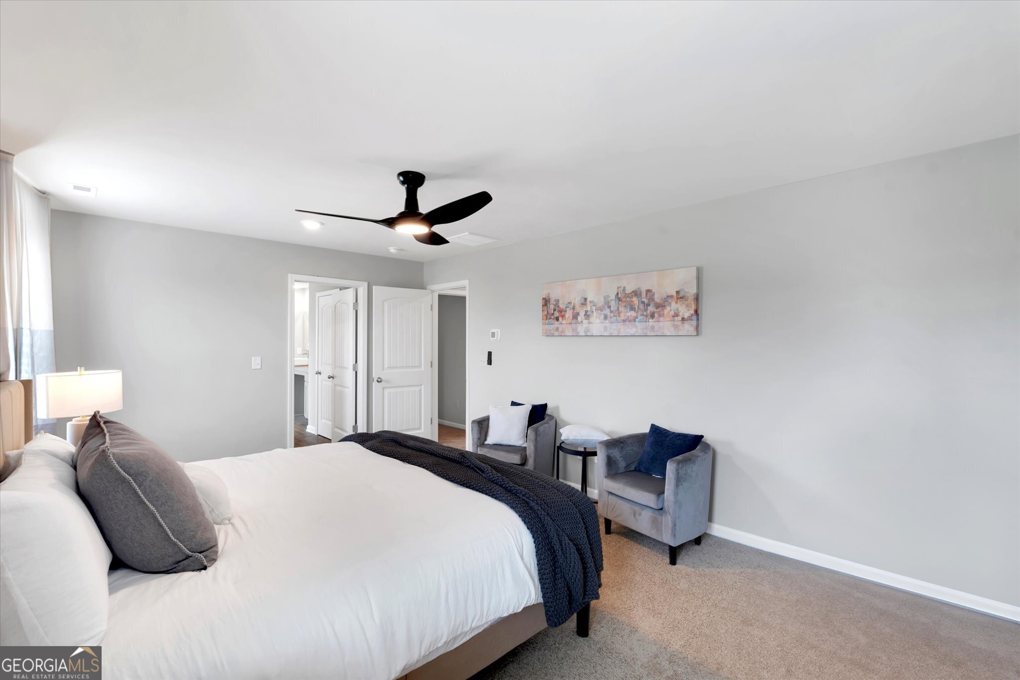 304 Rusty Plow Lane, Unit 22 Perry, GA 31069 - Photo 24 of 25 a bedroom with bed and a chandelier