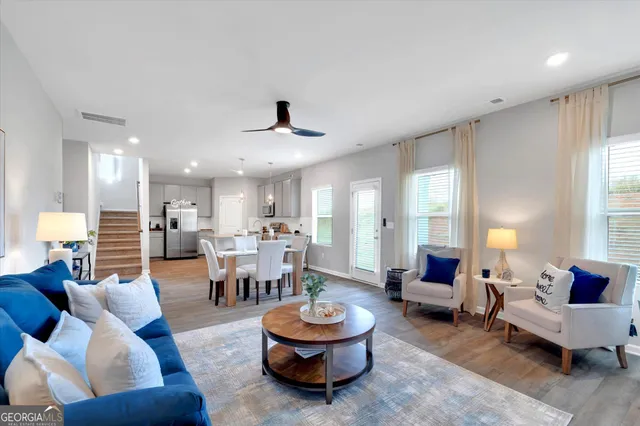 a living room with furniture and a large window
