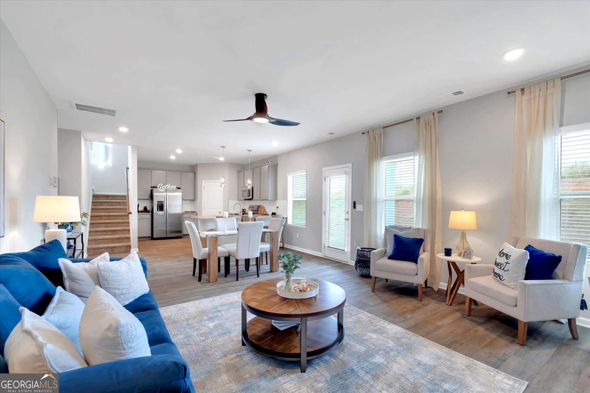 304 Rusty Plow Lane, Unit 22 Perry, GA 31069 - Photo 4 of 25 a living room with furniture and a large window