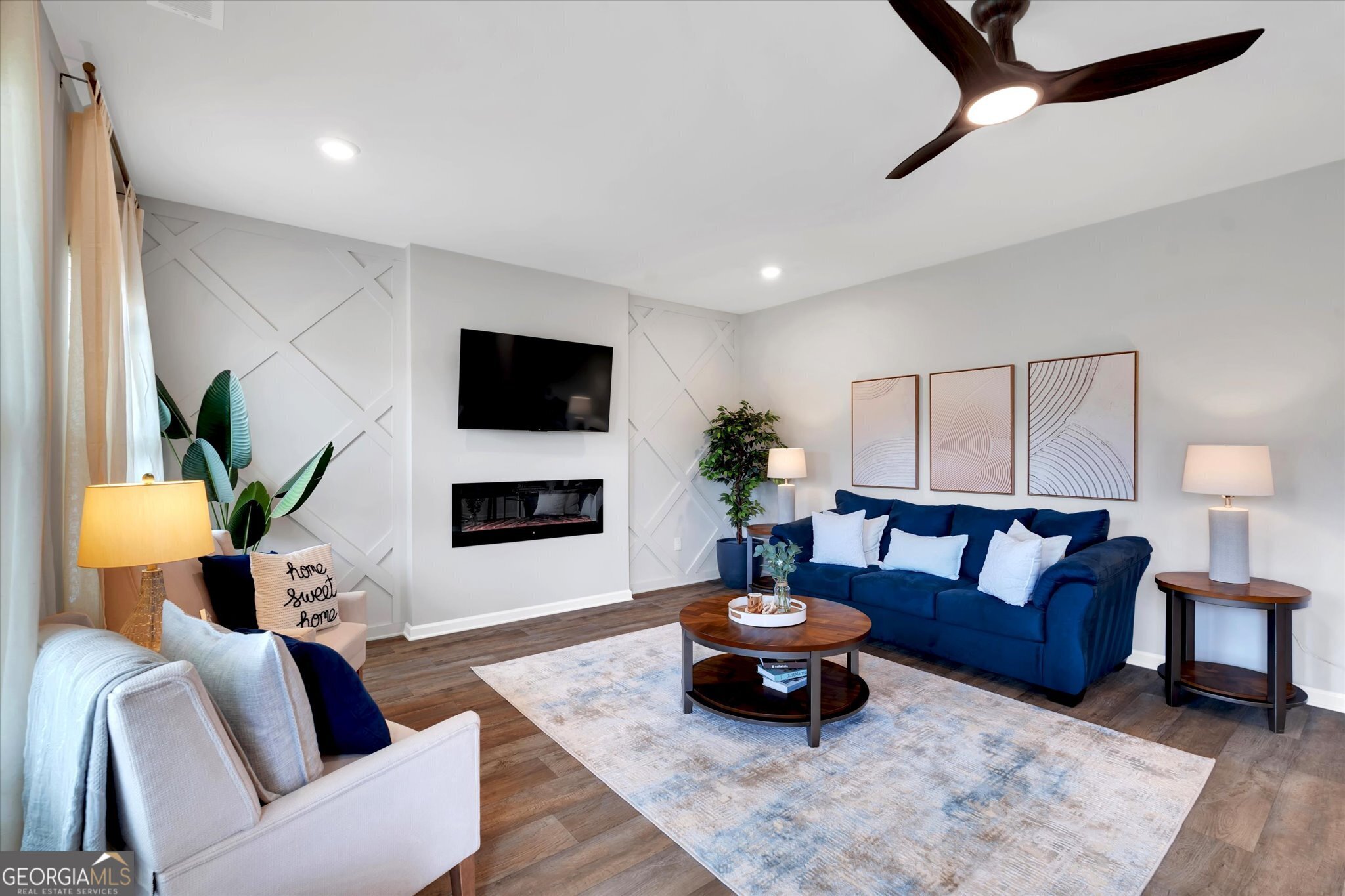 304 Rusty Plow Lane, Unit 22 Perry, GA 31069 - Photo 5 of 25 a living room with furniture and a flat screen tv