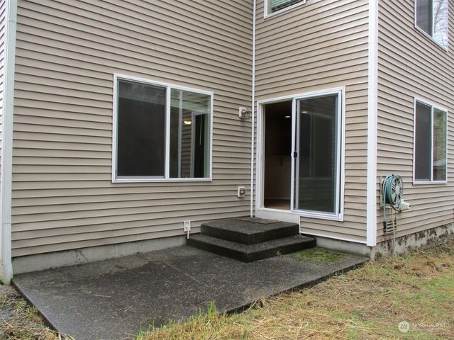 a front view of a house with stairs
