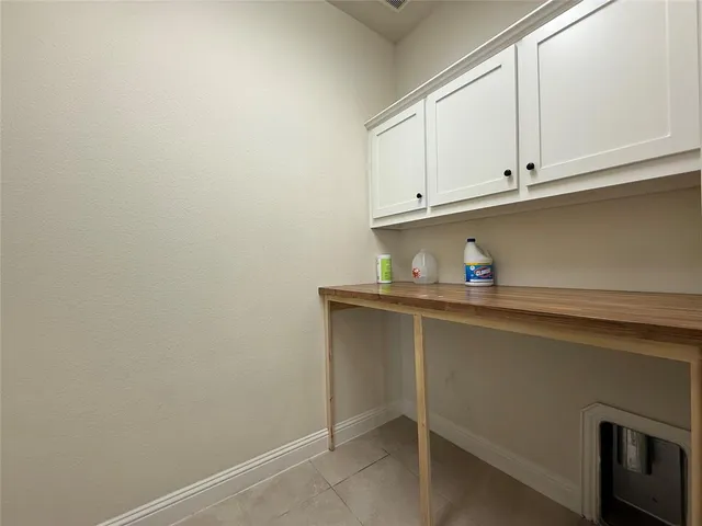 a spacious bathroom with a granite countertop sink mirror and bathtub