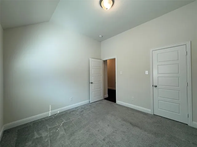 an empty room with closet area