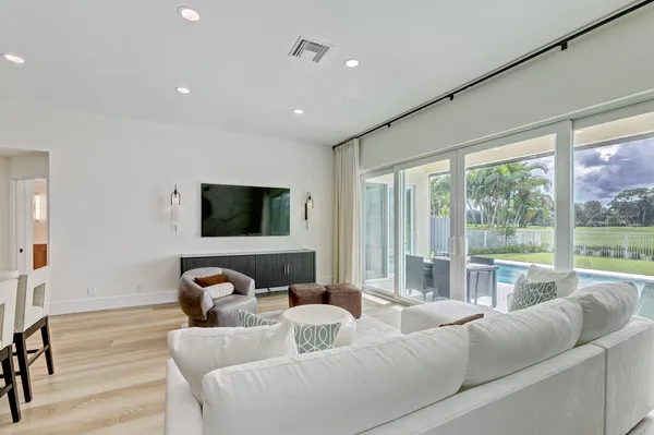 a living room with furniture and a large window