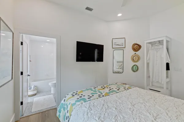 a bedroom with a bed and a couch