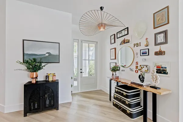 a large white kitchen with a large window