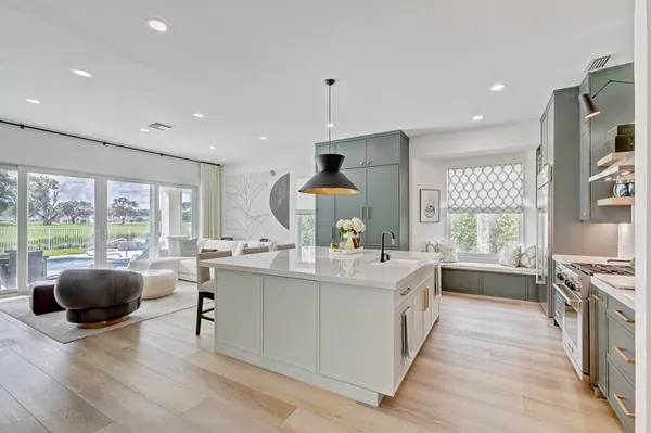 a dining room with furniture and wooden floor