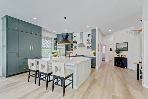 a bathroom with a sink a mirror and a shower