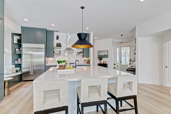 a kitchen with stainless steel appliances granite countertop a stove and a sink