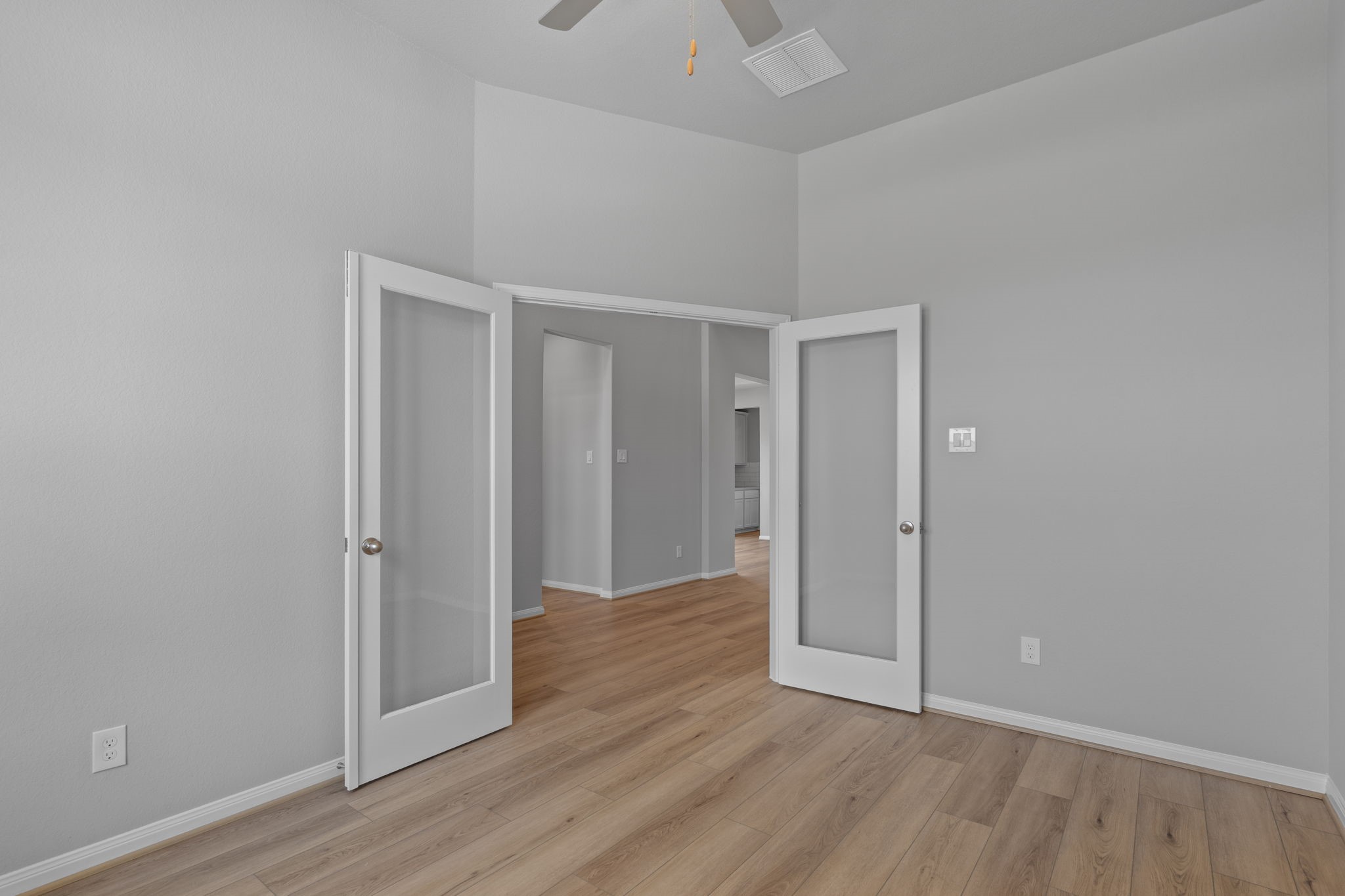 10726 Rattlebox Court Cypress, TX 77433 - Photo 14 of 36 a view of an empty room with wooden floor