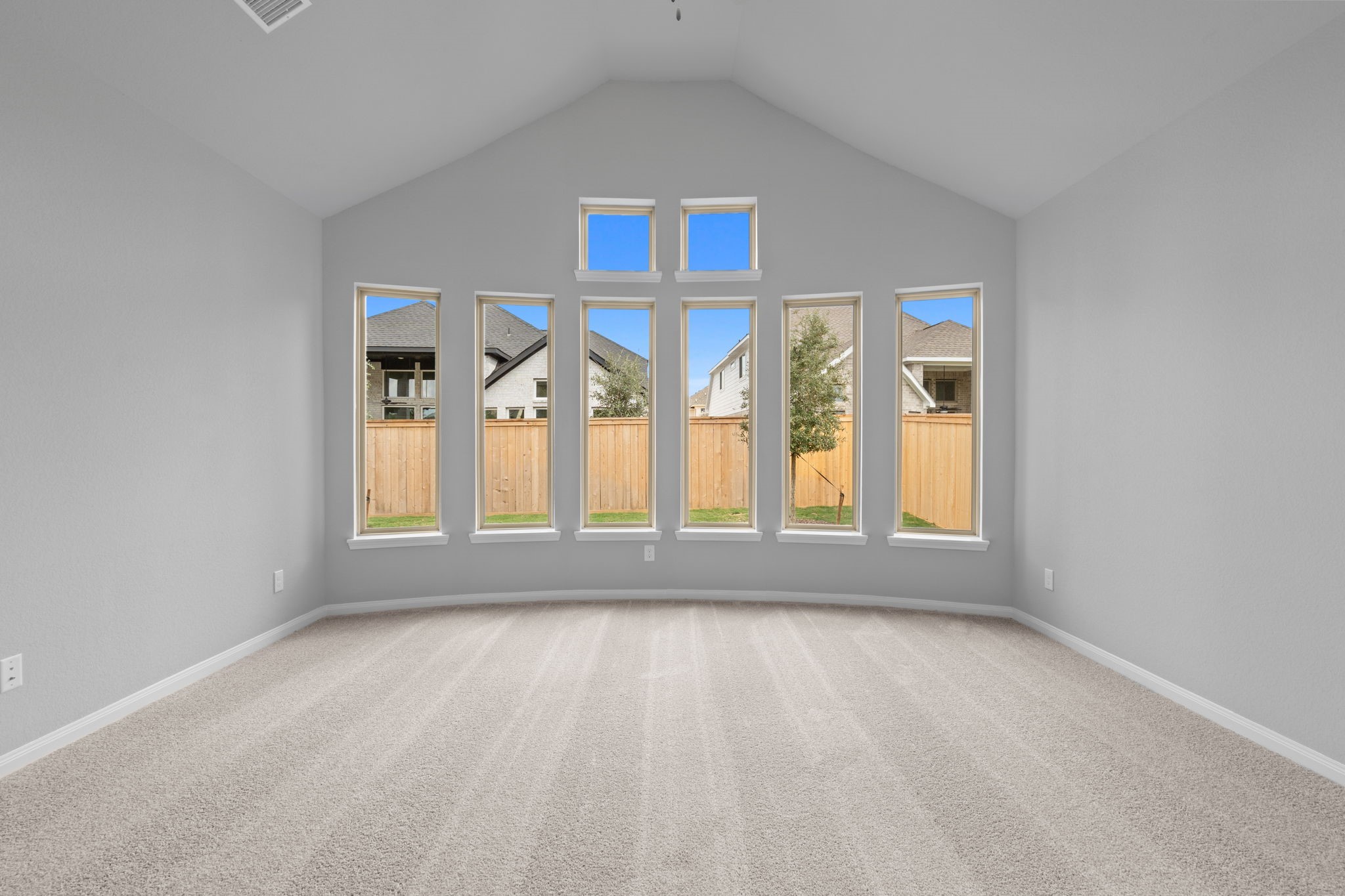 10726 Rattlebox Court Cypress, TX 77433 - Photo 21 of 36 an empty room with wooden floor and windows