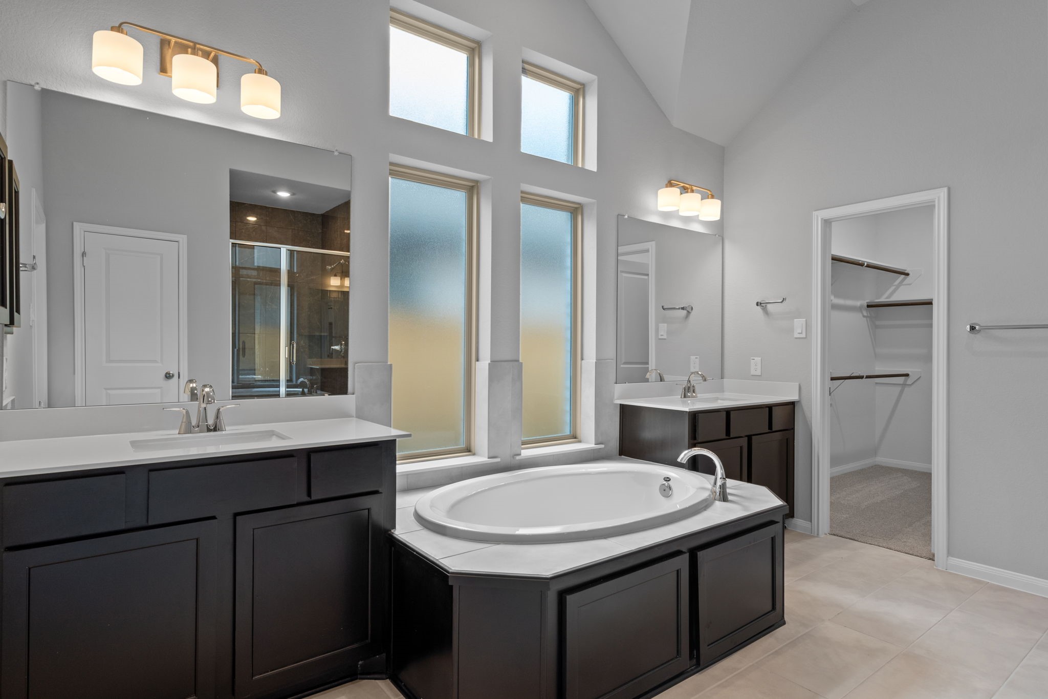 10726 Rattlebox Court Cypress, TX 77433 - Photo 22 of 36 a bathroom with a sink and a mirror