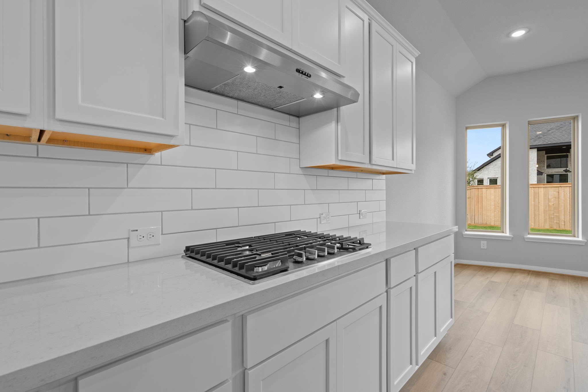 10726 Rattlebox Court Cypress, TX 77433 - Photo 6 of 36 a kitchen with stainless steel appliances a cabinets and a stove top oven