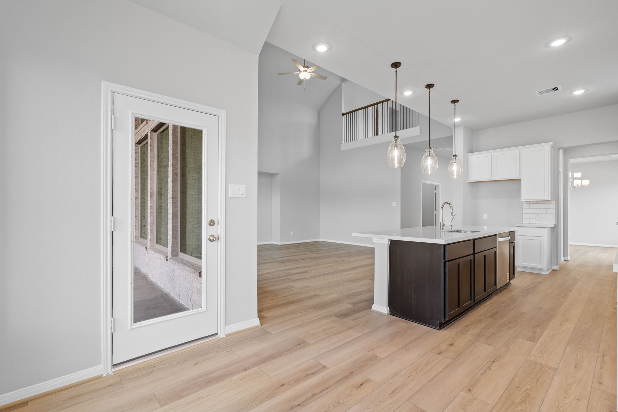 10726 Rattlebox Court Cypress, TX 77433 - Photo 8 of 36 a large kitchen with a large counter top appliances and cabinets