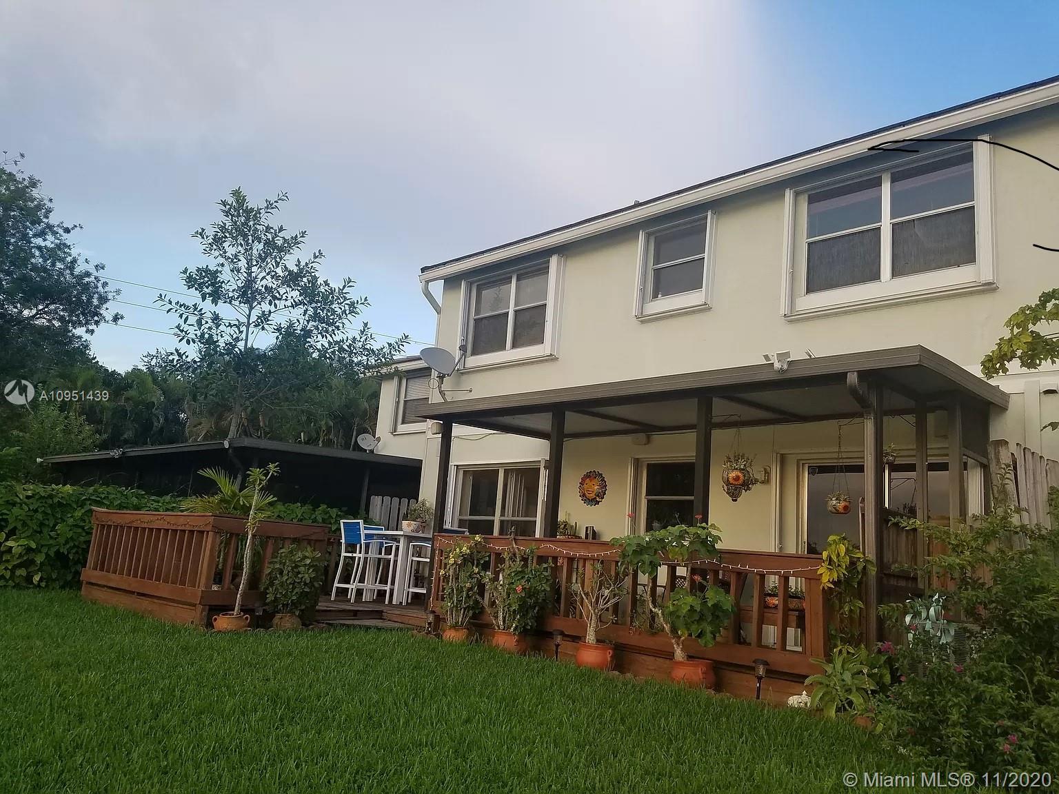 4709 Grapevine Way Davie, FL 33331 - Photo 2 of 41 View of the back entrance and patio porch.