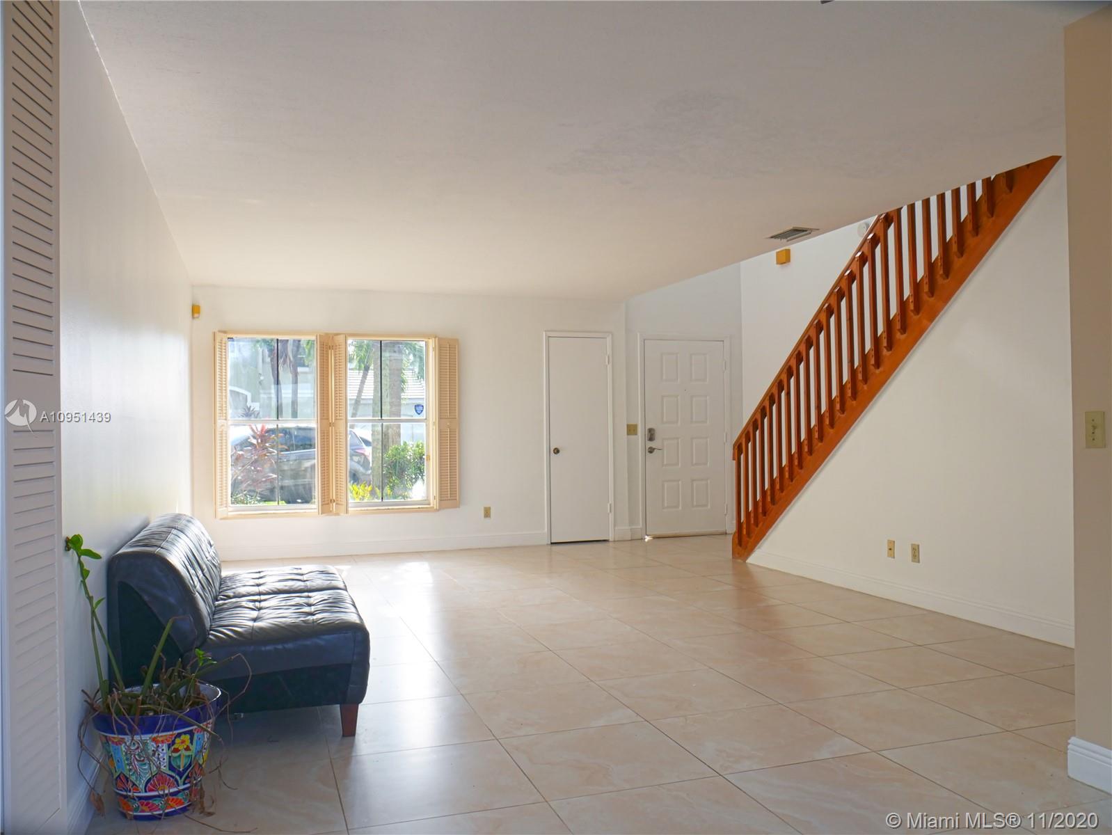 4709 Grapevine Way Davie, FL 33331 - Photo 12 of 41 The living room facing the front entrance.