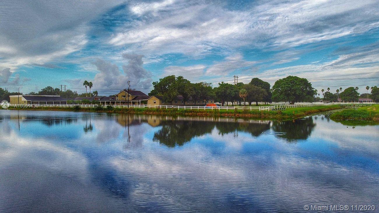 4709 Grapevine Way Davie, FL 33331 - Photo 3 of 41 Panoramic view of lake and horse ranch from back patio deck