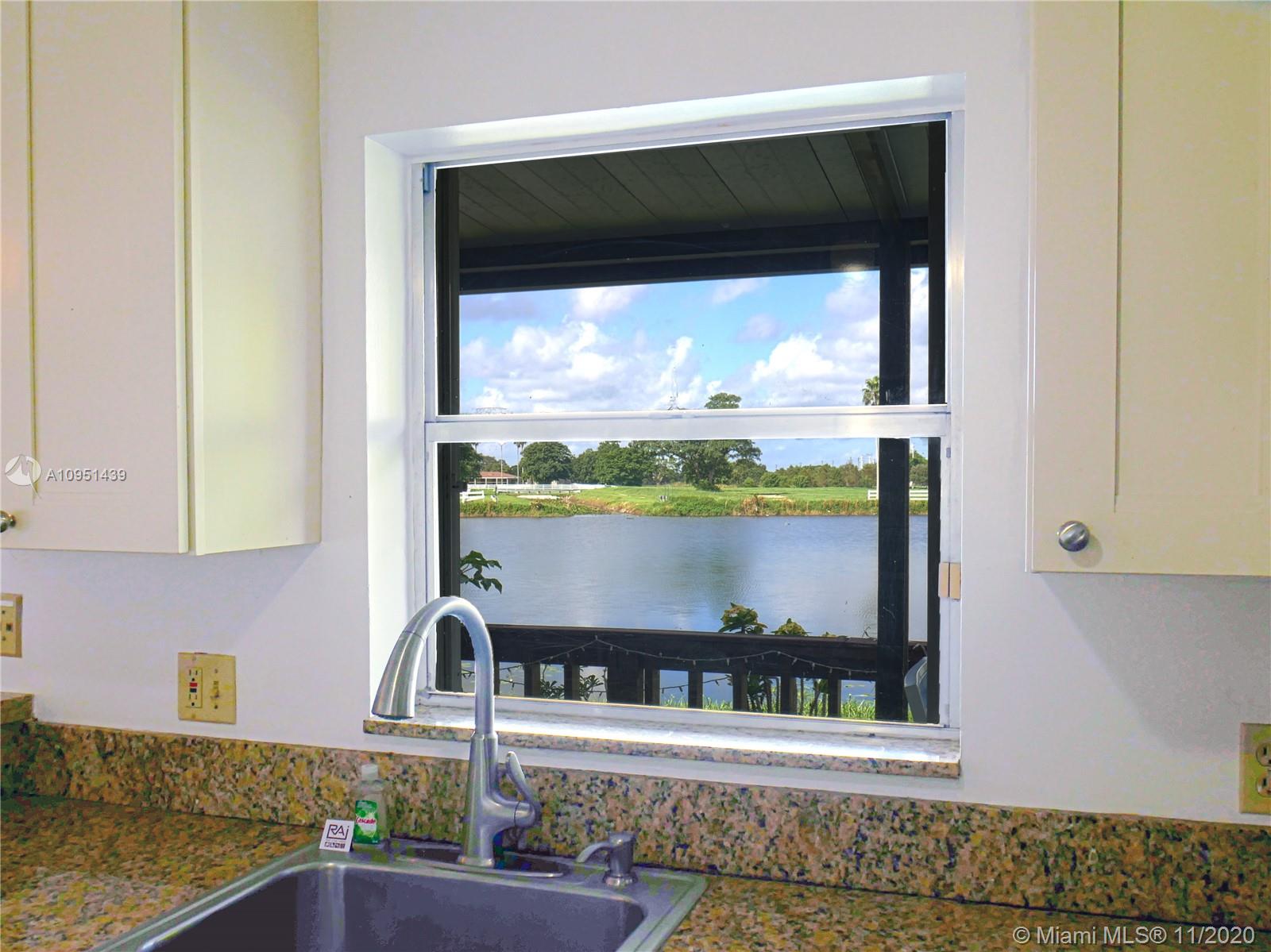 4709 Grapevine Way Davie, FL 33331 - Photo 21 of 41 View of the lake from the kitchen.