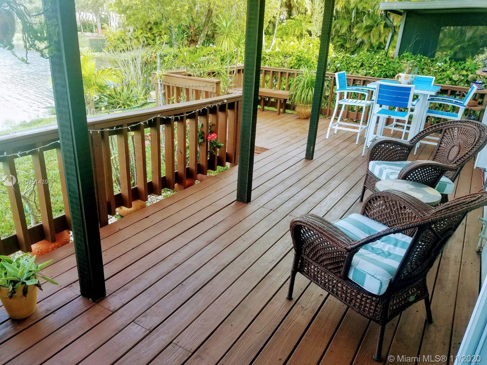 4709 Grapevine Way Davie, FL 33331 - Photo 4 of 41 Back patio deck complete with outside installed speakers, great atmosphere for relaxing or entertaining guests.