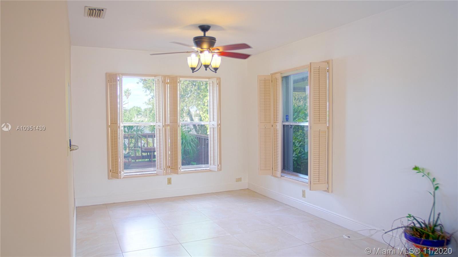 4709 Grapevine Way Davie, FL 33331 - Photo 9 of 41 Dining room with view of lake.