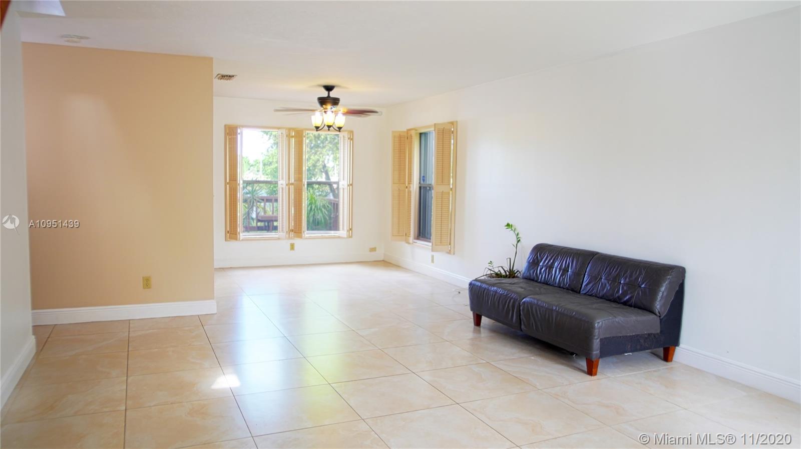 4709 Grapevine Way Davie, FL 33331 - Photo 10 of 41 Part of living room and dining room that over looks the lake.