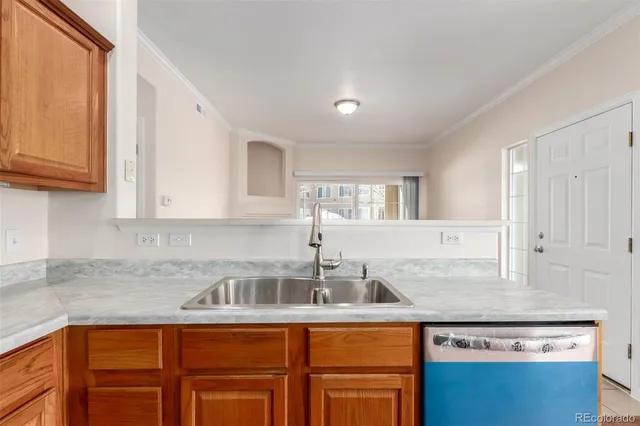 a kitchen with stainless steel appliances granite countertop a sink and cabinets