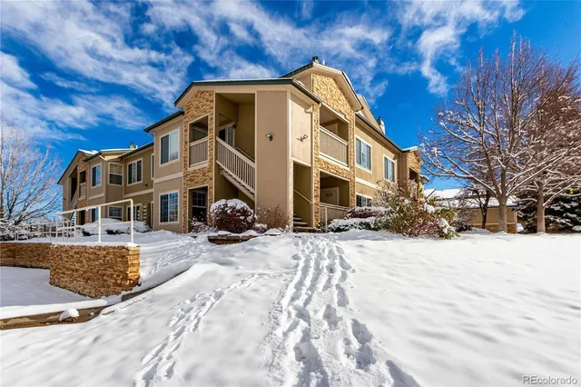 a view of a building with a yard