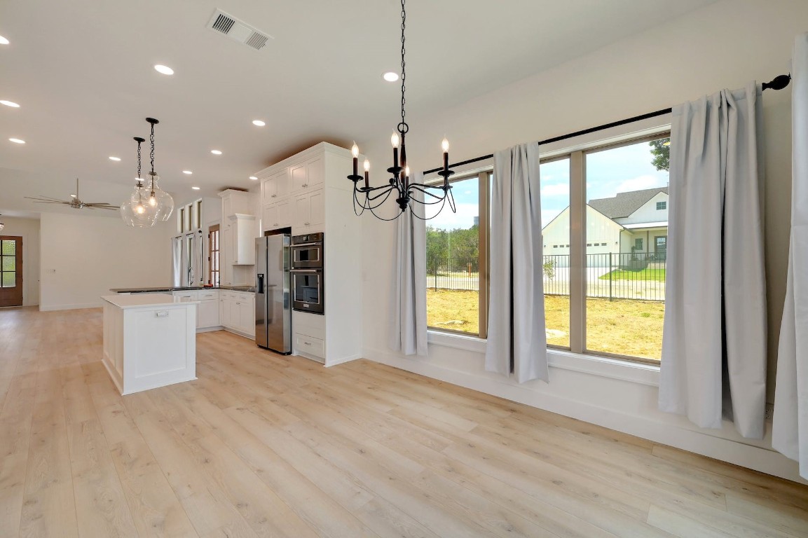 2 Cherokee Trail Wimberley, TX 78676 - Photo 11 of 26 a view of an empty room with kitchen and a window