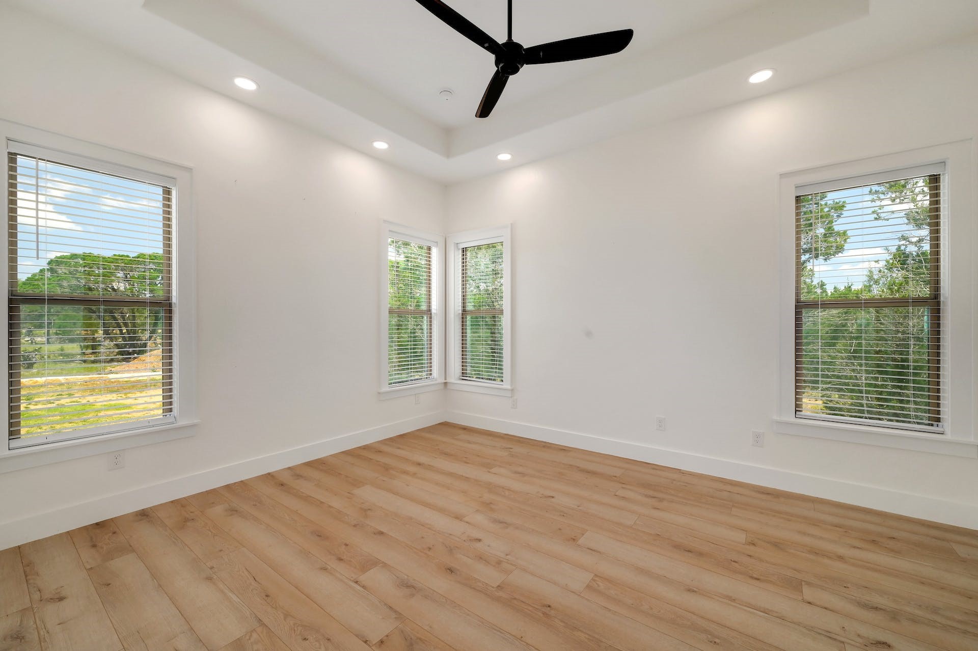 2 Cherokee Trail Wimberley, TX 78676 - Photo 13 of 26 a view of an empty room with wooden floor and a window